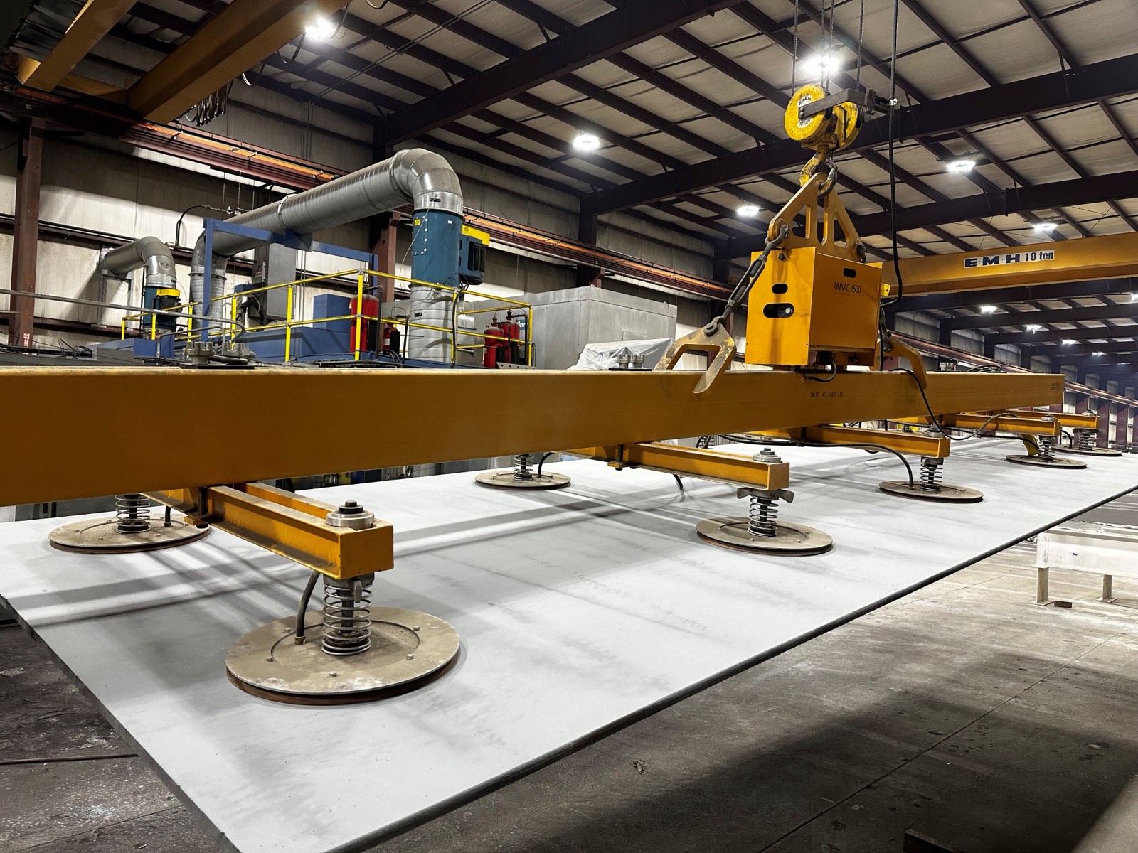 Vacuum lifting equipment handling steel plate at Regal Industrial